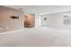 Open living area with neutral paint, carpet and windows bringing in natural light at 12649 Dallington Ter, Winter Garden, FL 34787