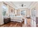 Spacious main bedroom with hardwood floors, tray ceiling, and ample natural light at 12649 Dallington Ter, Winter Garden, FL 34787