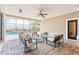 Covered patio with outdoor seating overlooking a sparkling pool at 12649 Dallington Ter, Winter Garden, FL 34787