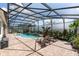 Relaxing pool area under a screen enclosure with patio furniture at 12649 Dallington Ter, Winter Garden, FL 34787