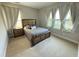 Bedroom with natural light and a view of the lake and lush backyard at 13065 Gabor Ave, Orlando, FL 32827