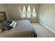 Bedroom with large window overlooking lush landscape at 13065 Gabor Ave, Orlando, FL 32827