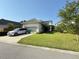 A well-manicured lawn and front yard, showcasing curb appeal and landscaping at 13065 Gabor Ave, Orlando, FL 32827