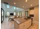 Bright kitchen with an island overlooking the living room, white cabinetry, and modern appliances at 13065 Gabor Ave, Orlando, FL 32827
