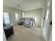 Bright upstairs living room with plush carpet and large sectional sofa, perfect for relaxing at 13065 Gabor Ave, Orlando, FL 32827