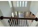 Elevated view of a bright living room featuring soaring ceilings and modern furnishings at 13065 Gabor Ave, Orlando, FL 32827
