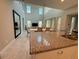 Spacious living room featuring high ceilings, a dining table, and a modern kitchen area at 13065 Gabor Ave, Orlando, FL 32827