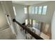 High angle of spacious living area with large windows, sliding doors, and stylish furnishings at 13065 Gabor Ave, Orlando, FL 32827