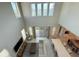 A top-down view of a well-appointed living room with high ceilings and stylish decor at 13065 Gabor Ave, Orlando, FL 32827