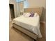 Comfortable main bedroom with a king bed and neutral décor for a relaxing retreat at 13065 Gabor Ave, Orlando, FL 32827