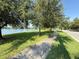 Scenic view of the community pond and surrounding lush landscaping with walking path at 13065 Gabor Ave, Orlando, FL 32827