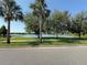 Scenic view of the community pond and surrounding lush landscaping at 13065 Gabor Ave, Orlando, FL 32827