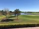 Scenic view of a golf course with serene water feature and lush green landscape at 13885 Arclid St, Orlando, FL 32832