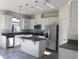Bright kitchen with stainless steel appliances, granite countertops, and a functional island at 13885 Arclid St, Orlando, FL 32832