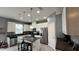 Modern kitchen featuring granite countertops, stainless steel appliances, and white cabinets at 13885 Arclid St, Orlando, FL 32832