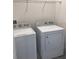 Laundry room with white washer and dryer units ready for use at 13885 Arclid St, Orlando, FL 32832