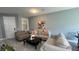 Comfortable living room features stylish decor, neutral paint, and ample seating perfect for entertaining at 13885 Arclid St, Orlando, FL 32832