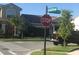 Street corner with a stop sign and lush greenery in a residential neighborhood at 13885 Arclid St, Orlando, FL 32832