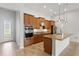 Well-equipped kitchen featuring granite countertops, stainless steel appliances, and wood cabinetry at 142 Olympus Way, Kissimmee, FL 34759