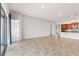 Bright living area with tile flooring and large glass doors leading to an outdoor space at 142 Olympus Way, Kissimmee, FL 34759