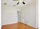 The bedroom offers ample space, hardwood floors, and a ceiling fan at 143 Brixham Ct, Kissimmee, FL 34758