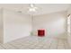Bright bedroom with a ceiling fan and white tile flooring at 143 Brixham Ct, Kissimmee, FL 34758