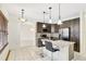 Eat-in kitchen with granite countertops, stainless appliances, and mosaic backsplash at 143 Brixham Ct, Kissimmee, FL 34758