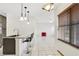 Kitchen view showcasing granite countertops and tile flooring at 143 Brixham Ct, Kissimmee, FL 34758