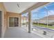 Screened-in lanai with a view of the pool, providing a relaxing outdoor space attached to home at 143 Brixham Ct, Kissimmee, FL 34758