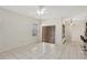 Open-concept living room with natural light and tile flooring at 143 Brixham Ct, Kissimmee, FL 34758