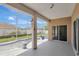 Enclosed patio with screened-in pool and sliding glass door access to the home's interior at 143 Brixham Ct, Kissimmee, FL 34758