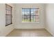 Bright room with large windows and tile flooring at 143 Brixham Ct, Kissimmee, FL 34758