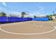 Well-maintained community basketball court surrounded by fencing, perfect for residents at 14389 Lanikai Beach Dr, Orlando, FL 32827