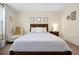 Bright bedroom with a comfortable chair, a nightstand, and decorative wall art at 14389 Lanikai Beach Dr, Orlando, FL 32827