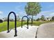 Convenient bike racks next to a sidewalk and grassy area, promoting a healthy lifestyle at 14389 Lanikai Beach Dr, Orlando, FL 32827