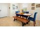 The dining room features a wood table with seating for six and a sunny window at 14389 Lanikai Beach Dr, Orlando, FL 32827