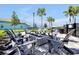 Cozy fire pit area with Adirondack chairs, creating an inviting space for outdoor gatherings at 14389 Lanikai Beach Dr, Orlando, FL 32827