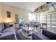 Finished garage area includes a sofa, television, and overhead storage at 14389 Lanikai Beach Dr, Orlando, FL 32827