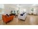 Open-concept living room with stylish furniture, neutral color palette, and cozy accents at 14389 Lanikai Beach Dr, Orlando, FL 32827