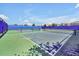 Well-maintained pickleball courts featuring blue and green surfaces and a secure fence, ideal for sports enthusiasts at 14389 Lanikai Beach Dr, Orlando, FL 32827