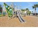 Community playground featuring modern slides and climbing structures, set in a safe, mulched area at 14389 Lanikai Beach Dr, Orlando, FL 32827