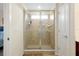 Modern bathroom featuring a glass enclosed shower with tiled walls and floor with built in shelves at 14389 Lanikai Beach Dr, Orlando, FL 32827