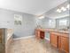 Bathroom featuring large vanity with granite countertop, large mirror and tile floors at 1470 Lake Side Ave, Davenport, FL 33837