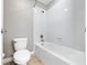 Bright, clean bathroom featuring a shower-tub combo with white tile surround and tile flooring at 1470 Lake Side Ave, Davenport, FL 33837