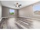 Bright bedroom features modern ceiling fan, hardwood floors, and lots of natural light at 1470 Lake Side Ave, Davenport, FL 33837