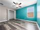 Bright bedroom features modern ceiling fan, hardwood floors, walk-in closet, and lots of natural light at 1470 Lake Side Ave, Davenport, FL 33837