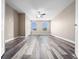 This bedroom features sleek, modern floors, a ceiling fan, and two windows that provide natural light at 1470 Lake Side Ave, Davenport, FL 33837