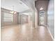 Open dining and living areas feature tile floors, lots of natural light, and arched doorways at 1470 Lake Side Ave, Davenport, FL 33837