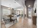 Open dining and living areas feature a dining table set, lots of natural light, and arched doorways at 1470 Lake Side Ave, Davenport, FL 33837