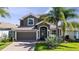 Charming two-story home with tile roof, well-maintained landscaping, and inviting curb appeal at 1470 Lake Side Ave, Davenport, FL 33837